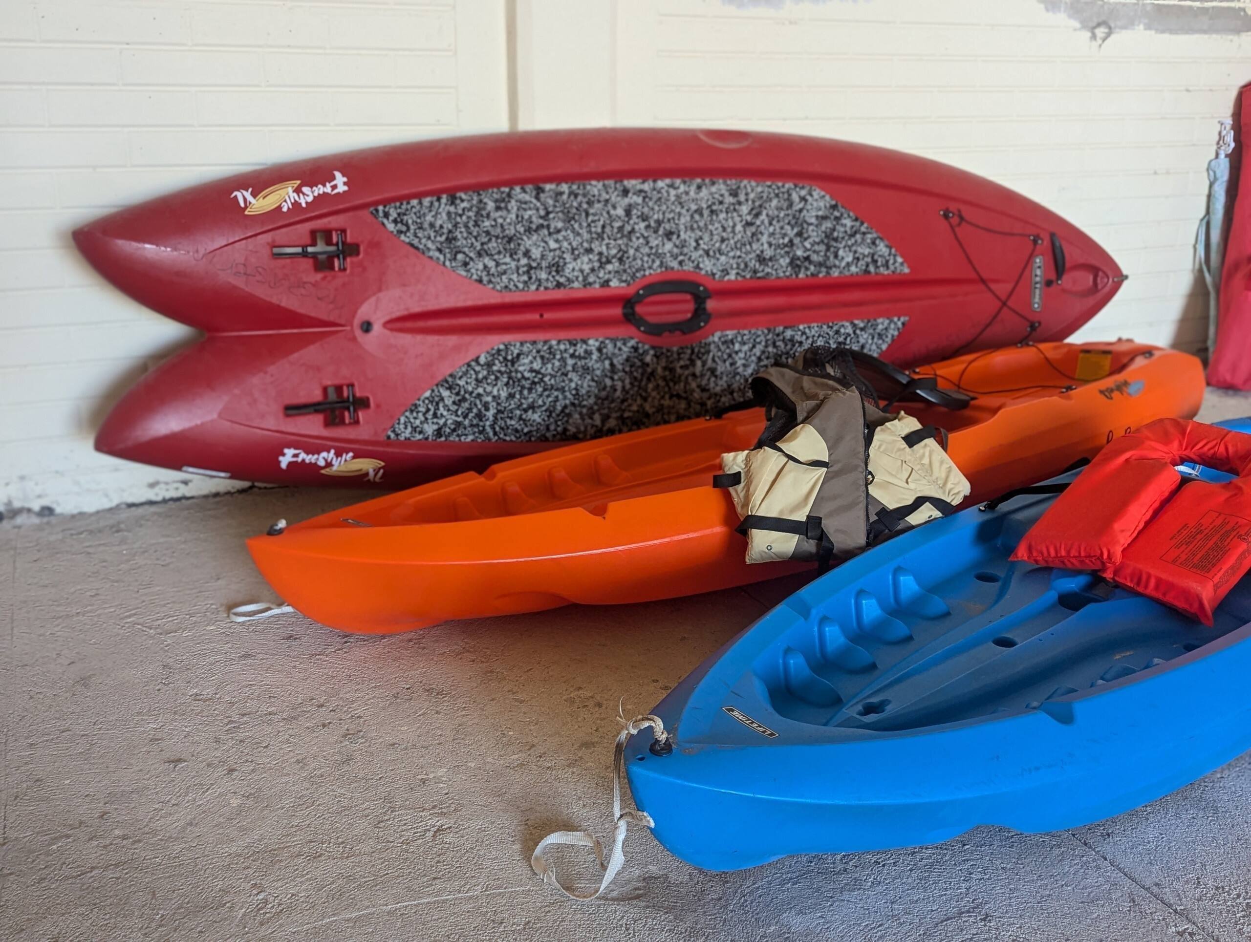 Kayaks, a paddleboard, and life jackets in the garage at Cholla Bay Vista