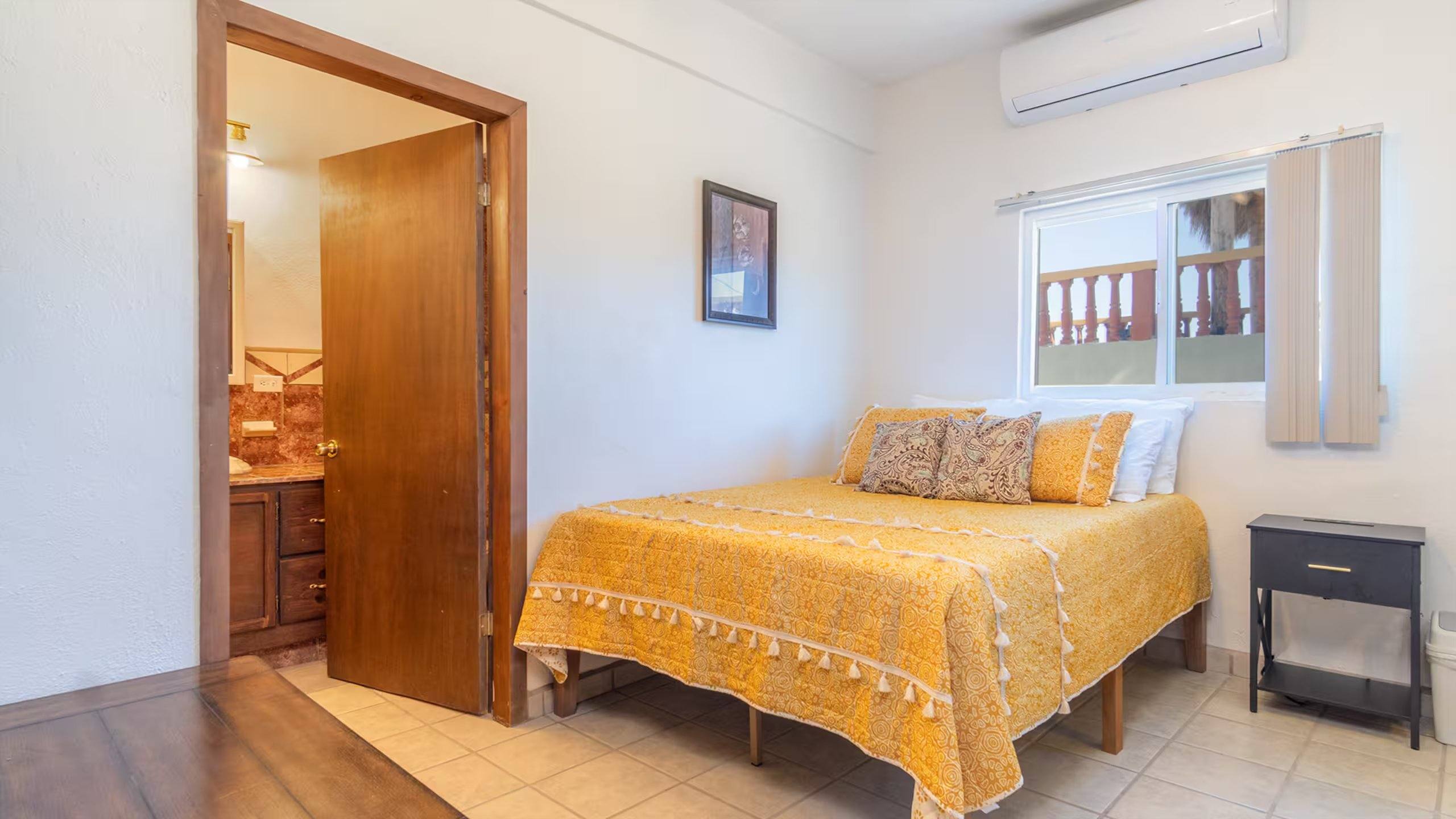 Primary bedroom at Cholla Bay Vista with a queen bed and yellow bedspread