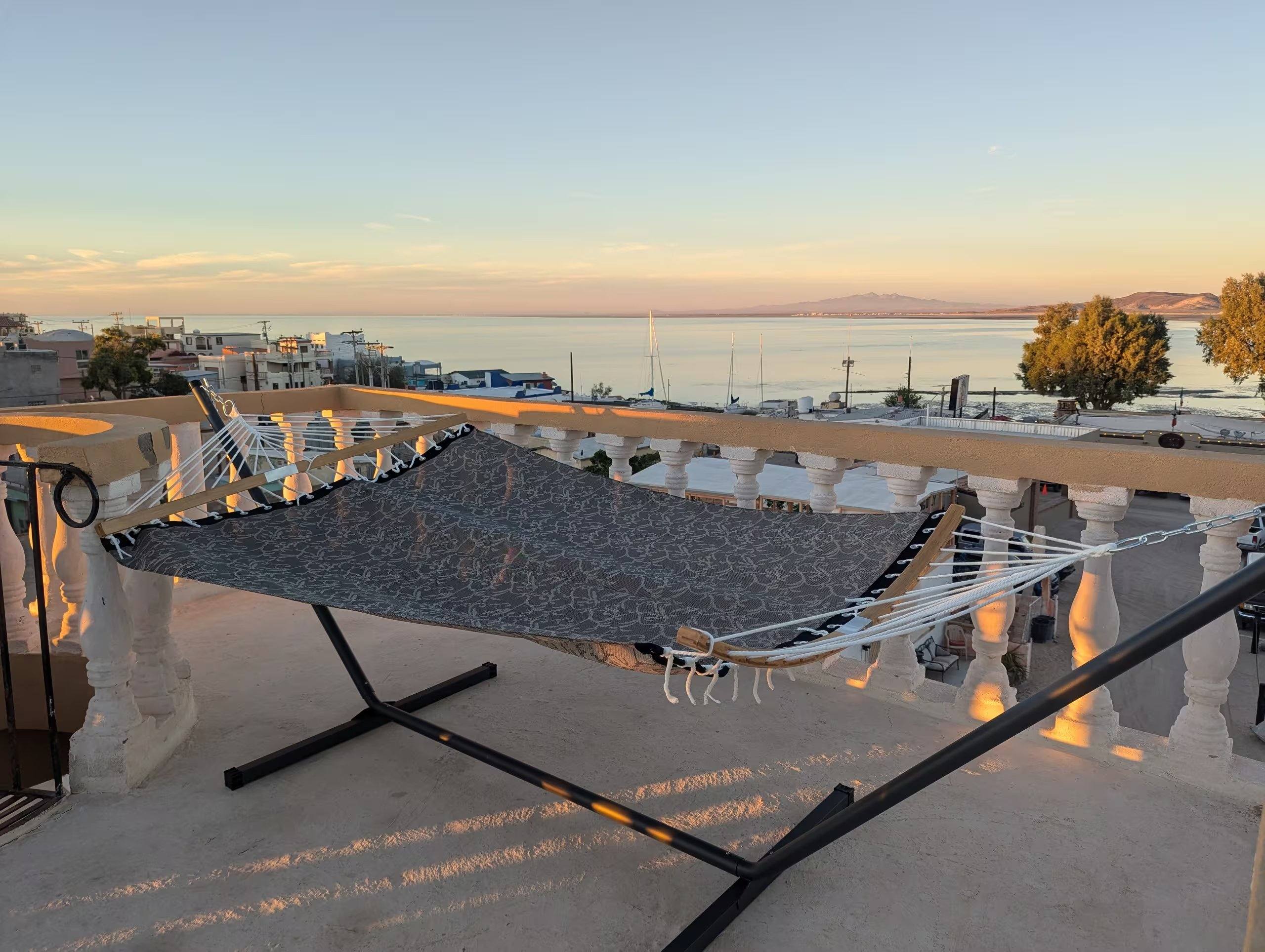 Rooftop hammock at Cholla Bay Vista at golden hour, overlooking Cholla Bay and the Sea of Cortez